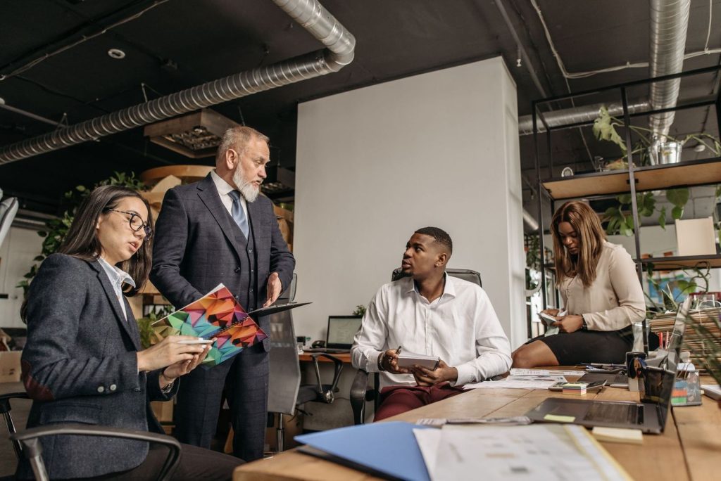 A small team meeting around an office table